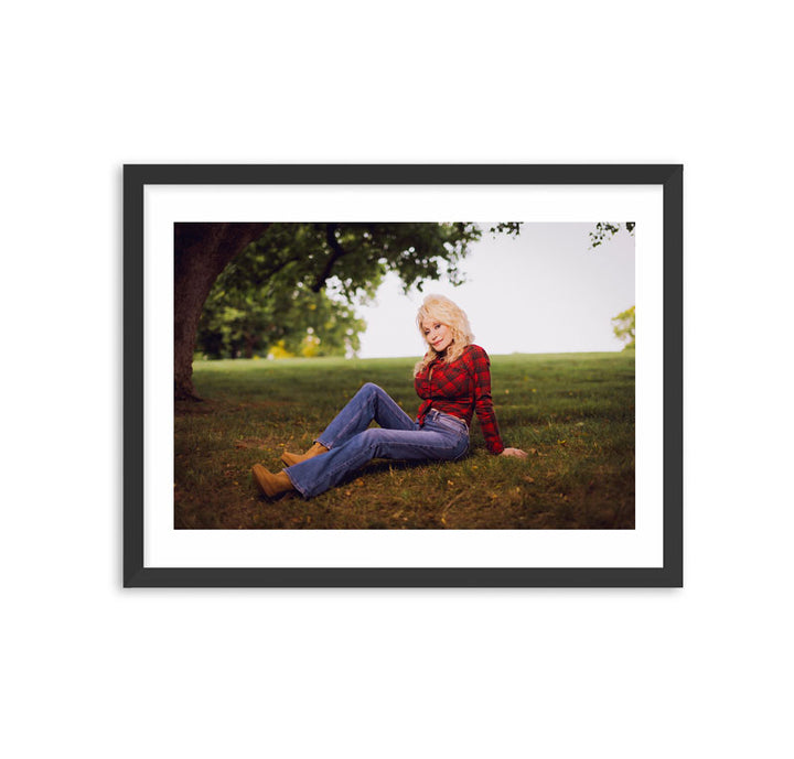 Framed Dolly Parton Sitting in Grass, 2021 Photo Print