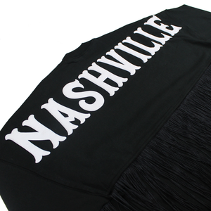 Black shirt with black fringe, featuring "Nashville" in white across the back.